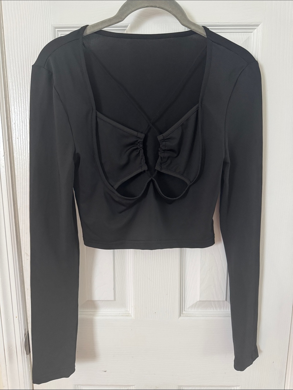 Black Long-Sleeve Crop Top with Open Back Knot Detail